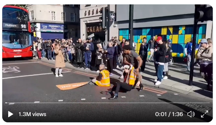 [VIDEO] Working Class Everywhere Have Had It! Watch Man Drag Leftists Out Of The Street So Motorists Can Pass